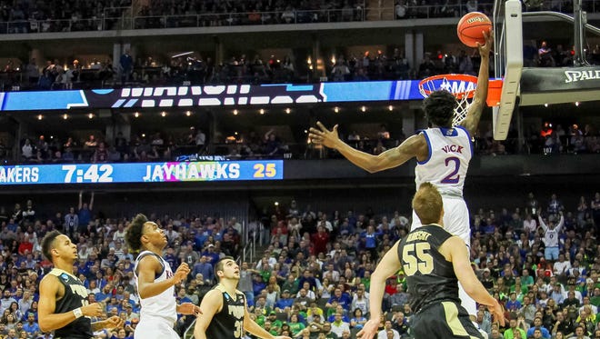 Kansas' Lagerald Vick (2) goes up for a shot against Purdue during Sweet 16 play.