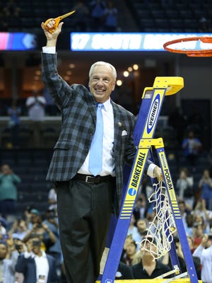 North Carolina Tar Heels head coach Roy Williams reacts after cutting down the nets after defeating the Kentucky Wildcats in the finals of the South Regional of the 2017 NCAA Tournament at FedExForum. North Carolina won 75-73.
