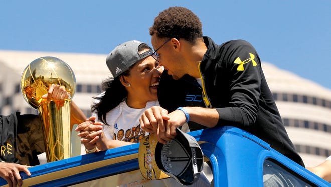 2015: Stephen Curry talks with his wife Ayesha Curry during the Golden State Warriors 2015 championship celebration.