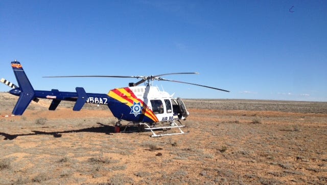Arizona Department of Public Safety officials rescue a Texas woman from a remote area near the Grand Canyon after she was stranded for five days on March 17, 2017.