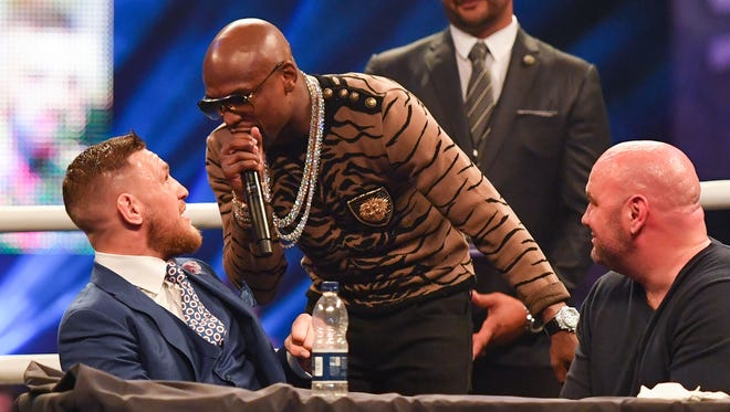 Floyd Mayweather shouts at Conor McGregor  during the press conference to promote the upcoming Mayweather vs McGregor boxing fight at SSE Arena.