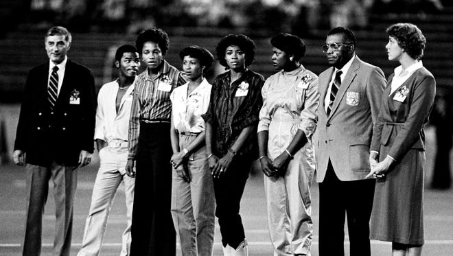 Vanderbilt is honoring Nashville's Olympic athletes prior to the football game with Miss State Sept. 20, 1980. Honored are U.S. Olympic committeeman Dr. Lee Minton, left, boxer Jackie Beard, track members Helen Blake, Debbie Jones, Kathy McMillan, Chandra Cheeseborough, Coach Ed Temple, and swimmer Tracy Caulkins. The group missed the Moscow Games because of the U.S. boycott.