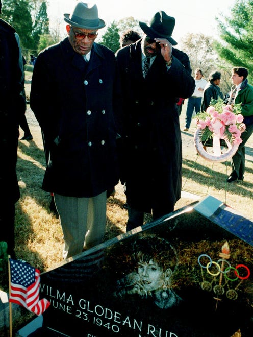 Family members and friends, including Ed Temple, left, checking out the grave side memorial to 1960 Olympic triple gold medalist and former Tennessee State University track star Wilma Rudolph Nov. 12, 1995. The Wilma Rudolph Memorial Committee dedicated the black marble memorial at Rudolph's grave in Clarksville's Foston Memorial Garden Cemetery, a year after she died in Nashville of cancer.