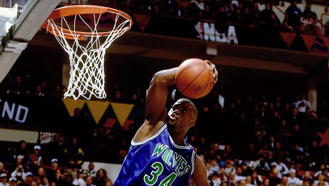 1994: Isaiah "JR" Rider of the skies for a slam dunk during the 1994 Slam Dunk Contest. He is most remembered for his "East Bay Funk" dunk in the contest, which he would win.