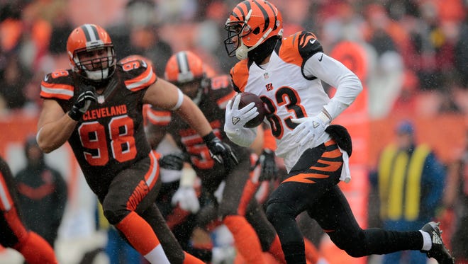 Cincinnati Bengals wide receiver Tyler Boyd (83) carries the ball on an end-around play in the first quarter during the Week 14 NFL game between the Cincinnati Bengals and the Cleveland Browns, Sunday, Dec. 11, 2016, at FirstEnergy Stadium in Cleveland.