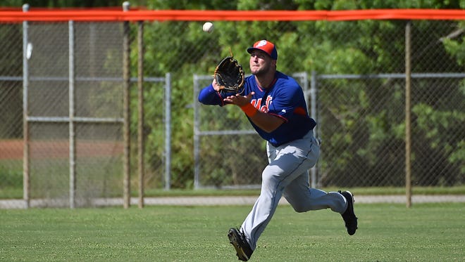 Sept. 20: Tim Tebow tracks down a fly ball during defensive drills.