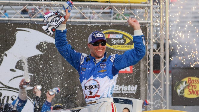 Kevin Harvick celebrates after winning the rain-delayed Bass Pro Shops NRA Night Race at Bristol Motor Speedway, his second win of 2016.