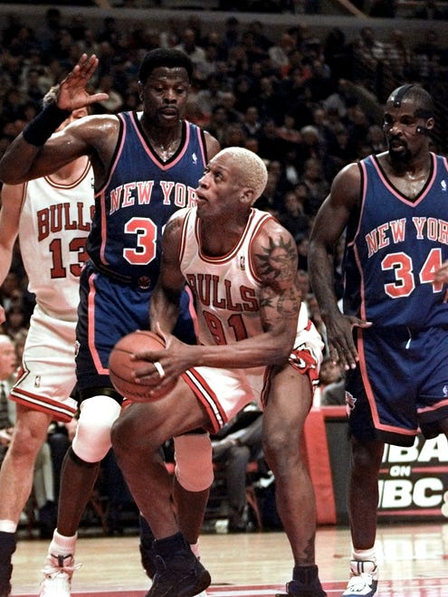 Chicago's Dennis Rodman (91) gets ready to shoot. At left is New York's Patrick Ewing (33) and at right is New York's Charles Oakley.