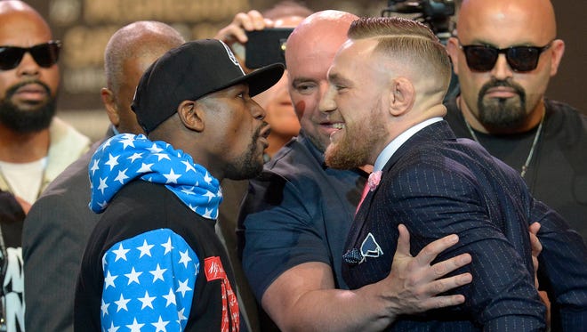 Floyd Mayweather and Conor McGregor meet face to face following the world tour press conference at Staples Center in Los Angeles to promote the upcoming Mayweather vs McGregor boxing match.