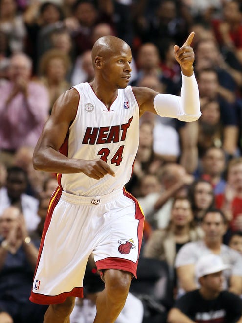 Ray Allen reacts after making a three-point shot against the Phoenix Suns in the first half of a game at American Airlines Arena.