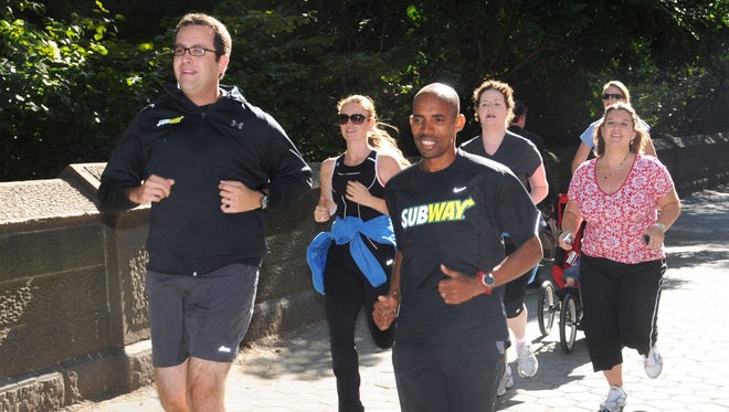 Subway's Jared Fogle (left) and U.S. runner Meb Keflezighi (right) run along the final stretch of the ING New York City Marathon race route Tuesday, September 21, 2010 near Manhattan's Central Park.
