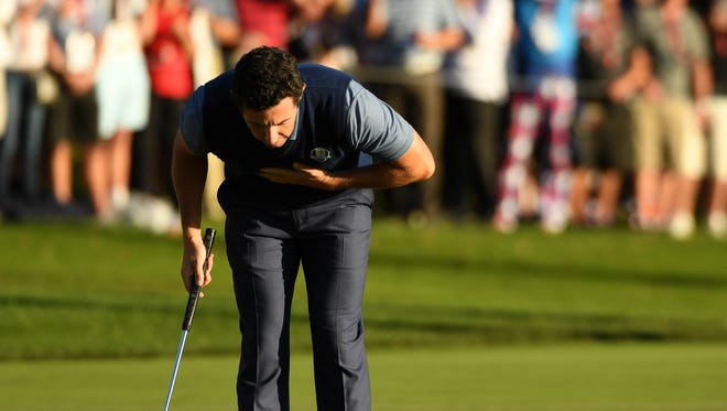 Rory McIlroy reacts after winning his match in the afternoon four-ball matches during the 41st Ryder Cup at Hazeltine National Golf Club.
