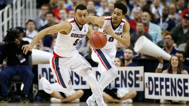 Gonzaga Bulldogs guard Nigel Williams-Goss (5) and guard Silas Melson (0) on a fast break against the West Virginia Mountaineers during the first half in the semifinals of the West Regional of the 2017 NCAA Tournament at SAP Center.