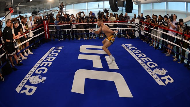 Conor McGregor warms up in the ring during a media workout in preparation for his fight against Floyd Mayweather at UFC Performance Institute.