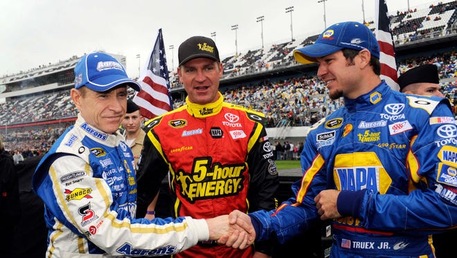 Clint Bowyer, center, joined Mark Martin, left, and Martin Truex Jr., right, at Michael Waltrip Racing at the start of the 2012 season.