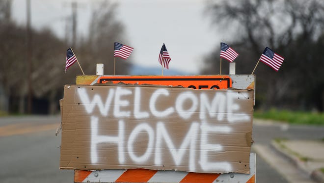A sign welcomes evacuees back to Oroville, Calif. following a flood evacuation.