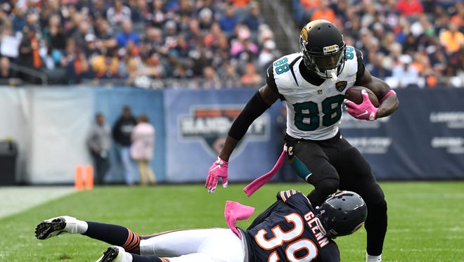 Chicago Bears cornerback Jacoby Glenn (39) attempts to tackle Jacksonville Jaguars wide receiver Allen Hurns (88) during the first half at Soldier Field.