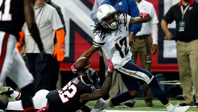 Chargers wide receiver Travis Benjamin (12) is tackled by Falcons safety Keanu Neal (22) during the second quarter.