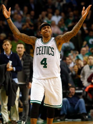 Boston Celtics guard Isaiah Thomas (4) celebrates during the fourth quarter against the Toronto Raptors at TD Garden.