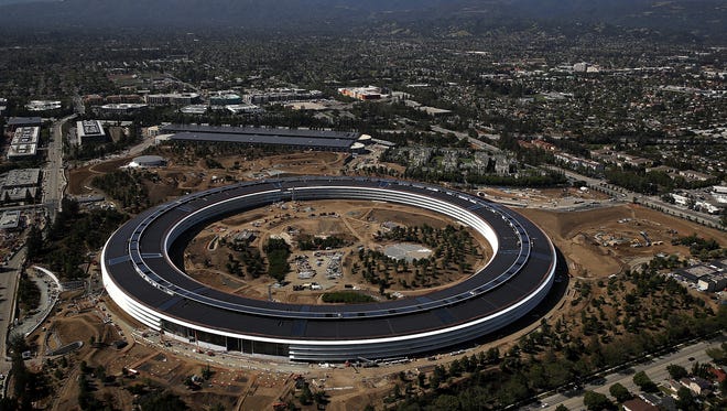An aerial view of the new Apple headquarters on April 28, 2017 in Cupertino, California. Apple's new 175-acre 'spaceship' campus dubbed 'Apple Park' is nearing completion and is set to begin moving in Apple employees. The new headquarters, designed by Lord Norman Foster and costing roughly $5 billion, will house 13,000 employees in over 2.8 million square feet of office space and will have nearly 80 acres of parking to accommodate 11,000 cars.