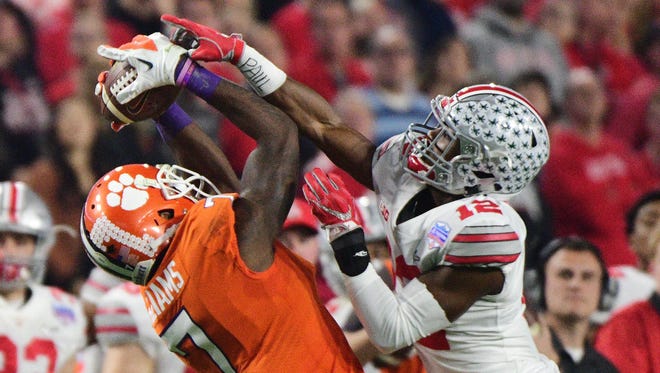 Clemson wide receiver Mike Williams makes a catch in front of Denzel Ward.