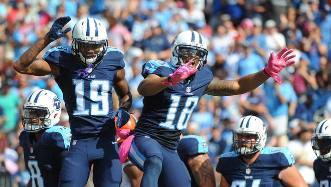 Tennessee TItans receiver Rishard Matthews (18) celebrates with receiver Tajae Sharpe (19) after a touchdown in the first half against the Cleveland Browns at Nissan Stadium.