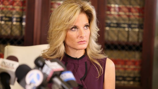 Summer Zervos, a former candidate on "The Apprentice," speaks to the press with her attorney Gloria Allred Oct. 14, 2016 in Los Angeles.