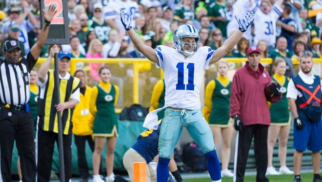 Cowboys wide receiver Cole Beasley (11) celebrates after scoring a touchdown during the first quarter against the Packers.