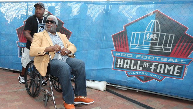 Houston Oilers former running back Earl Campbell enters the stadium during the Pro Football Hall of Fame enshrinement ceremonies at the Tom Benson Hall of Fame Stadium.