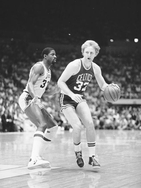 Boston Celtics' Larry Bird (33) moves around Los Angeles Lakers' Earvin "Magic" Johnson (32) during first period action of the NBA championship at the Los Angeles Forum, June 3, 1984.