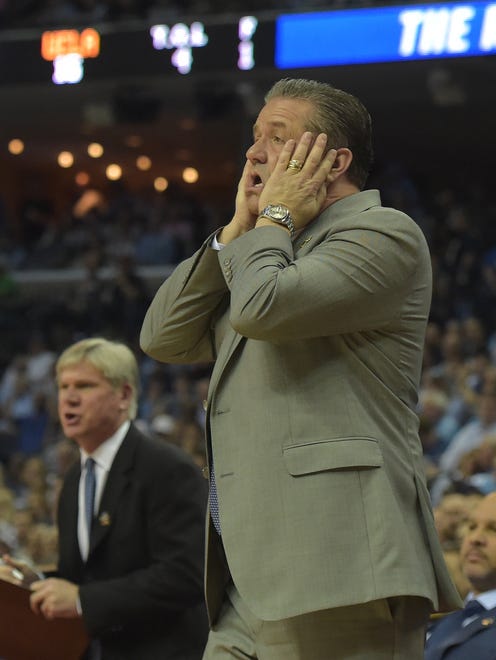 Kentucky coach John Calipari reacts to a play during the first half against UCLA in the Sweet 16 of the NCAA tournament at FedExForum in Memphis.