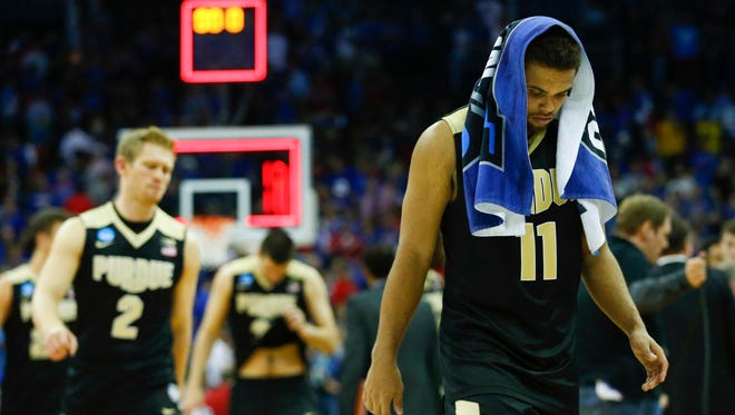 Purdue's P.J. Thompson walks off the court following a Sweet 16 loss to Kansas.