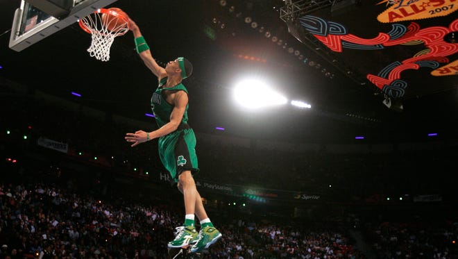 2007: Gerald Green leaps over a table on his dunk in the finals of the NBA Slam Dunk Contest. Green won the competition, beating out eventual three-time winner, Nate Robinson.