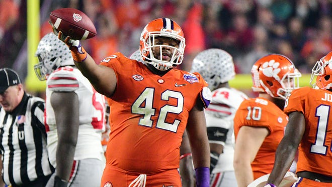 Clemson defensive lineman Christian Wilkins recovers an Ohio State fumble early in the second half.