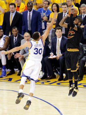 Kyrie Irving shoots the game-winning shot over Stephen Curry in Game 7 of the NBA Finals.