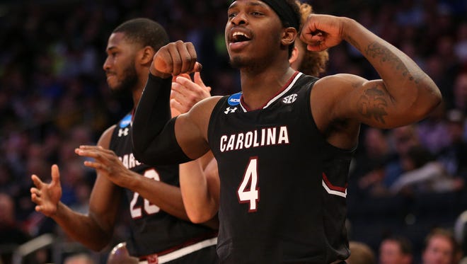 South Carolina guard Rakym Felder (4) celebrates with a flex from the bench during the second half against Baylor in the Sweet 16 of the NCAA tournament at Madison Square Garden in New York.