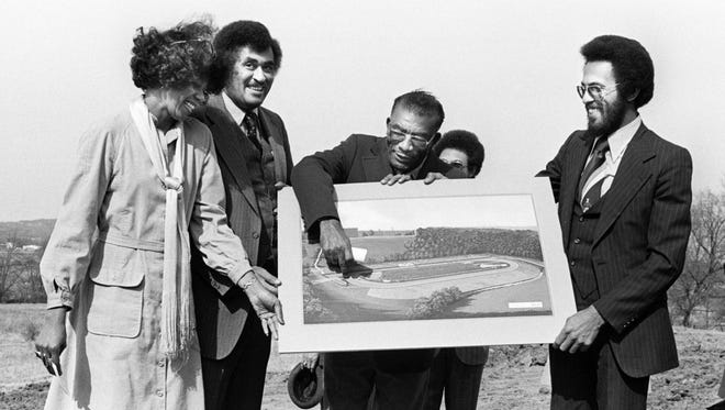 Showing off the artist rendering of the new Tennessee State University track are former Tigerbelle great Wilma Rudolph Eldridge, left, TSU President Fredric Humphries, coach Ed Temple and architect Harold Thompson March 9, 1977.