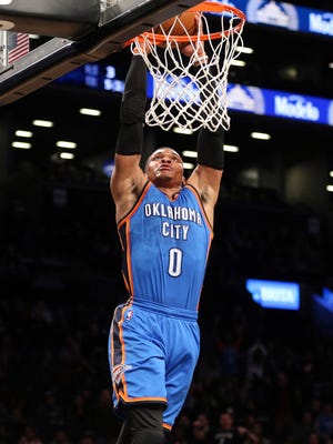 Oklahoma City Thunder point guard Russell Westbrook (0) dunks against the Brooklyn Nets during the first quarter at Barclays Center.