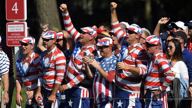 USA fans cheer on the fourth hole in the afternoon four-ball matches during the 41st Ryder Cup at Hazeltine National Golf Club.