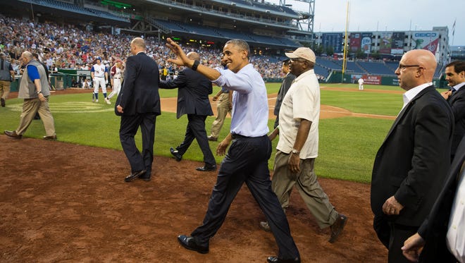 President Obama smiles as he makes a visit to the congressional baseball game at Nationals Park on June 11, 2015, in Washington.