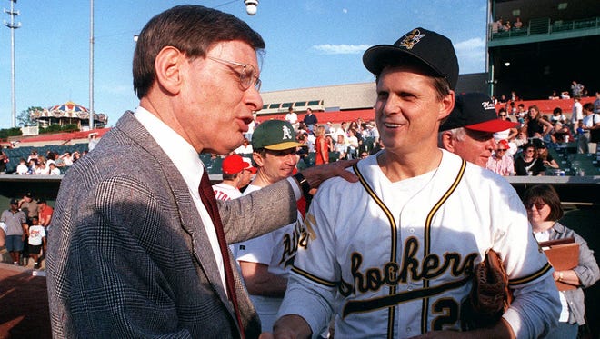 Baseball commisioner Bud Selig, left, shakes hands with Rep. Todd Tiahrt, R-Kan., prior to the 38th annual Roll Call congressional baseball game in Bowie, Md.,on June 24, 1999.