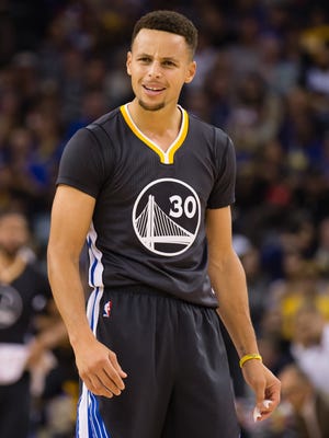 Golden State Warriors guard Stephen Curry reacts towards the referee during the first quarter against the Phoenix Suns.
