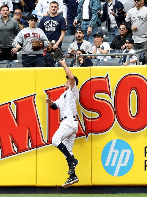 April 30: Aaron Judge makes a catch at the wall on a ball hit by Manny Machado of the Orioles.