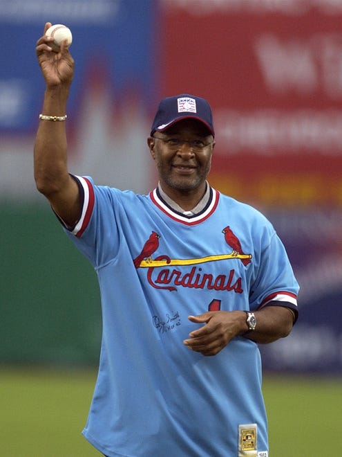 Former St. Louis Cardinals shortstop Ozzie Smith waves the ball before throwing out the first pitch prior to the 42nd annual congressional baseball game on July 10, 2003, at Prince George's Stadium in Bowie, Md.