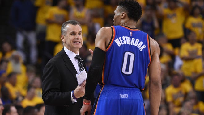 Oklahoma City Thunder head coach Billy Donovan (left) instructs guard Russell Westbrook (0) against the Golden State Warriors during the second quarter in game seven of the Western conference finals of the NBA Playoffs at Oracle Arena.