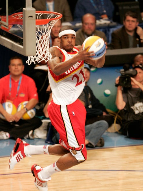2005: Josh Smith dons an old-time Atlanta Hawks jersey in honor of Dominique Wilkins during the NBA Rising Stars Slam Dunk contest in Denver. He would go on to win the contest.