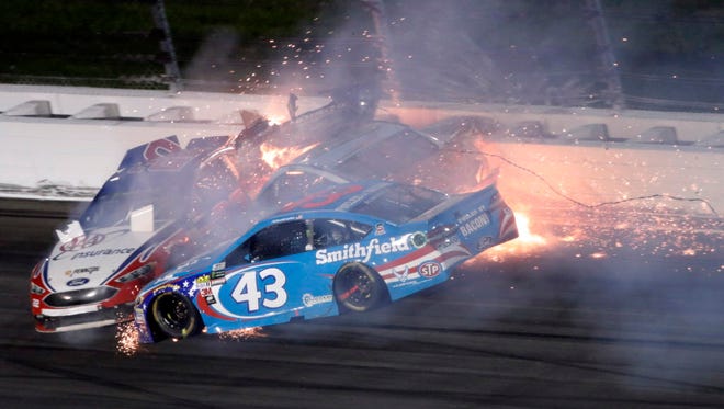 Aric Almirola (43) crashes into Danica Patrick and Joey Logano during the Monster Energy NASCAR Cup Series Go Bowling 400 at Kansas Speedway on May 13, 2017 in Kansas City, Kan.