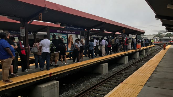 Morning Commuters gather on a platform at the 69th Street Terminal station in Upper Darby, Pa. on Aug. 22, 2017.