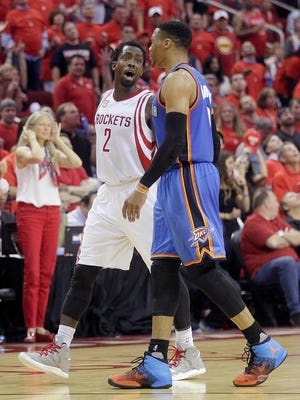 Houston Rockets guard Patrick Beverley (2) and Oklahoma City Thunder guard Russell Westbrook (0) exchange words in the second half in game five of the first round of the 2017 NBA Playoffs at Toyota Center.