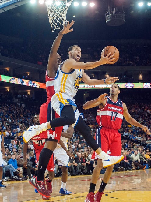 2013: Stephen Curry attempts a shot against the Washington Wizards.